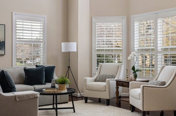 Modern homeowners are increasingly looking for practical ways to reduce energy consumption while improving indoor comfort. One effective yet often overlooked solution is the installation of exterior window shutters. Unlike interior window treatments that primarily enhance aesthetics, exterior shutters act as a protective thermal barrier between the home and outdoor conditions. They help regulate indoor temperatures, minimize energy loss, and support year round efficiency. Windows are among the largest sources of heat gain and heat loss in residential buildings. Even high quality glazing systems can allow significant temperature transfer when exposed to direct sunlight, wind, or cold air. Exterior shutters provide an additional insulating layer that improves energy performance without requiring major structural changes. Understanding how they work and why they are effective can help homeowners make informed decisions about sustainable home improvements. Understanding How Energy Loss Happens Through Windows Before exploring the benefits of shutters, it is important to understand why windows contribute heavily to energy inefficiency. Glass surfaces transfer heat far more easily than insulated walls. During summer, sunlight passes through windows and raises indoor temperatures. In winter, warm indoor air escapes through glass panes and window frames. Common causes of energy loss through windows include: Solar heat gain from direct sunlight Air leakage around frames and gaps Thermal conduction through glass Radiative heat transfer during cold weather Exterior shutters address several of these issues simultaneously by creating a physical barrier that reduces exposure to external temperature fluctuations. How Exterior Window Shutters Improve Thermal Insulation Exterior shutters function as an additional insulation layer installed outside the window. When closed, they trap a pocket of air between the shutter and the glass surface. This trapped air acts as a natural insulator, slowing heat transfer. Unlike curtains or blinds placed indoors, shutters stop heat before it reaches the window itself. This distinction significantly improves efficiency because preventing heat transfer is more effective than trying to manage it after it enters the home. The insulating effect works in both directions: Prevents outdoor heat from entering during warm seasons Reduces indoor heat loss during colder months This dual functionality makes shutters a year round energy solution rather than a seasonal upgrade. Reducing Heat Gain During Summer Months In warm climates or during peak summer, windows exposed to direct sunlight can dramatically increase indoor temperatures. Sunlight entering through glass converts into heat energy and becomes trapped inside rooms, a phenomenon often referred to as the greenhouse effect. Exterior shutters reduce solar heat gain by blocking sunlight before it contacts the glass surface. This lowers indoor temperature buildup and reduces reliance on air conditioning systems. Key summer efficiency advantages include: Lower indoor temperature fluctuations Reduced cooling system workload Improved comfort in sun facing rooms Less overheating near windows Homes with west and south facing windows often experience the most noticeable improvements because these areas receive intense afternoon sunlight. Preventing Heat Loss in Winter Energy efficiency is not only about keeping heat out. During colder months, maintaining indoor warmth becomes the primary concern. Windows typically have lower insulation values compared to walls, allowing heat to escape quickly. Exterior shutters provide a protective layer that reduces exposure to cold air, wind, and nighttime temperature drops. When shutters are closed at night, they help: Retain indoor warmth for longer periods Reduce heating system usage Minimize drafts near windows This improved insulation can contribute to consistent indoor temperatures, especially in older homes where window efficiency may be limited. Airflow Control and Draft Reduction Air leakage around windows is a major contributor to energy waste. Even small gaps allow conditioned air to escape while outdoor air enters the home. Exterior shutters help limit airflow directly against window surfaces. By shielding windows from wind pressure, they reduce the amount of air forced through tiny openings or imperfect seals. This protective effect becomes particularly valuable during storms or windy seasons when drafts tend to increase energy consumption. In addition, controlled ventilation can still be achieved by partially opening adjustable shutter panels, allowing airflow without fully exposing windows. Protection Against Solar Radiation Solar radiation is responsible for a large portion of unwanted heat inside homes. Standard glass allows visible light and infrared radiation to pass through, increasing indoor temperatures even when outdoor air feels moderate. Exterior shutters reflect or absorb a significant amount of solar radiation before it reaches the window. This reduces radiant heat transfer and helps maintain cooler interiors naturally. Materials and finishes also influence performance. Light colored shutters reflect sunlight, while insulated or composite materials add another thermal barrier. Over time, reduced solar exposure also protects interior furnishings from fading, which indirectly supports sustainability by extending the lifespan of indoor materials. Supporting HVAC System Efficiency Heating and cooling systems work hardest when indoor temperatures fluctuate rapidly. Poor window insulation forces HVAC systems to run longer cycles to maintain comfort. By stabilizing indoor conditions, exterior shutters reduce strain on these systems. Less frequent cycling leads to improved operational efficiency and potentially longer equipment lifespan. Energy efficiency improvements can include: Reduced peak energy demand More consistent thermostat performance Lower mechanical wear on HVAC components When temperature changes occur gradually rather than suddenly, energy usage becomes more predictable and manageable. Enhancing Passive Energy Design Passive energy design focuses on reducing energy consumption through architectural features rather than mechanical systems. Exterior shutters align closely with this principle. They allow homeowners to actively manage sunlight and insulation depending on daily and seasonal needs. For example, shutters can remain open during winter days to allow solar warmth inside and closed at night to retain heat. This flexibility creates a dynamic energy management approach that adapts to changing environmental conditions. Passive efficiency strategies supported by shutters include: Seasonal solar control Natural temperature regulation Reduced reliance on powered cooling or heating Such adaptability makes shutters particularly valuable in regions with varying seasonal climates. Noise Reduction as an Energy Related Benefit While primarily associated with comfort, noise reduction also contributes indirectly to energy efficiency. Exterior shutters add an extra layer between indoor spaces and the outside environment, helping dampen sound transmission. Quieter interiors often allow occupants to rely less on mechanical systems like fans or sound masking devices, which consume electricity. The added mass and spacing created by shutters can reduce external disturbances such as traffic noise, wind sounds, or neighborhood activity, creating a calmer indoor environment that complements overall home performance. Durability and Long Term Energy Savings Energy efficient upgrades should provide lasting performance to justify their environmental impact. Exterior shutters are typically constructed from durable materials such as aluminum, hardwood, vinyl, or composite panels designed for outdoor exposure. Their longevity contributes to sustainability in several ways: Reduced need for frequent replacements Minimal maintenance compared to fabric window coverings Consistent insulation performance over time Because shutters protect windows from weather exposure, they may also extend the lifespan of window frames and glazing systems, preventing premature deterioration caused by sun, rain, or debris. Smart Operation and Modern Automation Advancements in home technology have enhanced the energy saving potential of exterior shutters. Automated systems allow shutters to open and close based on temperature, sunlight intensity, or programmed schedules. Smart operation improves efficiency by ensuring shutters respond to environmental conditions even when occupants are not home. Examples of automated energy optimization include: Closing shutters during peak afternoon heat Opening panels for winter sunlight exposure Adjusting positions to maintain balanced daylight Automation reduces human error and maximizes energy savings throughout the year. Environmental Impact and Sustainability Advantages Lower energy consumption directly reduces a household’s environmental footprint. When homes require less heating and cooling, they consume fewer fossil fuel resources and produce fewer emissions associated with electricity generation. Exterior shutters contribute to sustainable living by supporting energy conservation without relying on complex technology or continuous energy input. Environmental benefits include: Reduced carbon emissions from energy use Lower dependence on artificial cooling Improved overall building efficiency Because shutters operate passively, their environmental impact remains low after installation. Comparing Exterior Shutters with Interior Window Treatments Interior blinds and curtains offer privacy and light control but have limited impact on energy performance compared to exterior solutions. The main difference lies in where heat control occurs. Interior treatments manage heat after it has already entered through the window, while exterior shutters stop heat at the source. Exterior shutters typically provide: Better insulation performance Improved solar reflection Greater protection from weather exposure Enhanced durability outdoors This exterior positioning gives them a clear advantage in energy management strategies. Seasonal Flexibility and Year Round Comfort One of the strongest advantages of exterior shutters is their adaptability across seasons. Instead of serving a single purpose, they function as a multi season energy control system. During summer, they block heat and glare. During winter, they preserve indoor warmth. In transitional seasons, adjustable panels allow controlled ventilation and daylight. This flexibility helps maintain consistent indoor comfort without constant thermostat adjustments, improving overall living conditions while conserving energy. Conclusion Energy efficiency has become a central priority in modern home design, and windows remain one of the most important areas for improvement. Installing exterior window shutters provides a practical and effective way to enhance insulation, reduce heat transfer, and support sustainable energy use. By blocking solar radiation, minimizing heat loss, reducing drafts, and stabilizing indoor temperatures, shutters help lower dependence on heating and cooling systems throughout the year. Their passive operation, durability, and adaptability make them a valuable addition for homeowners seeking long term efficiency improvements. Rather than relying solely on mechanical solutions, exterior shutters demonstrate how thoughtful architectural features can significantly influence energy performance. As homes continue to evolve toward smarter and more sustainable living environments, exterior shutters remain a reliable solution for improving comfort while conserving energy.